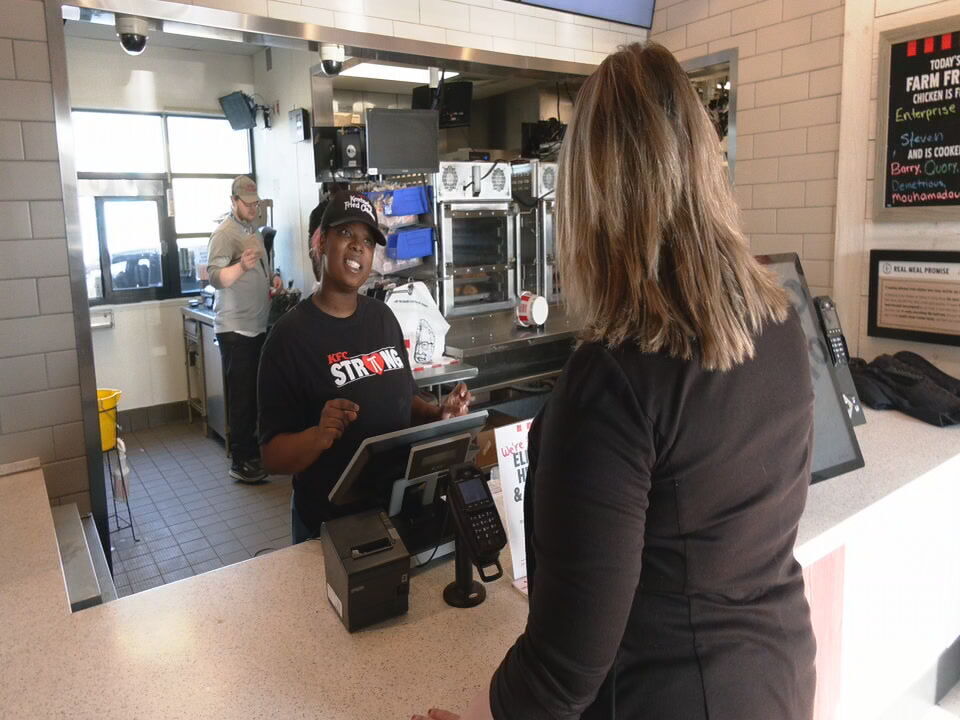 KFC employee takes order at Hikes Point location
